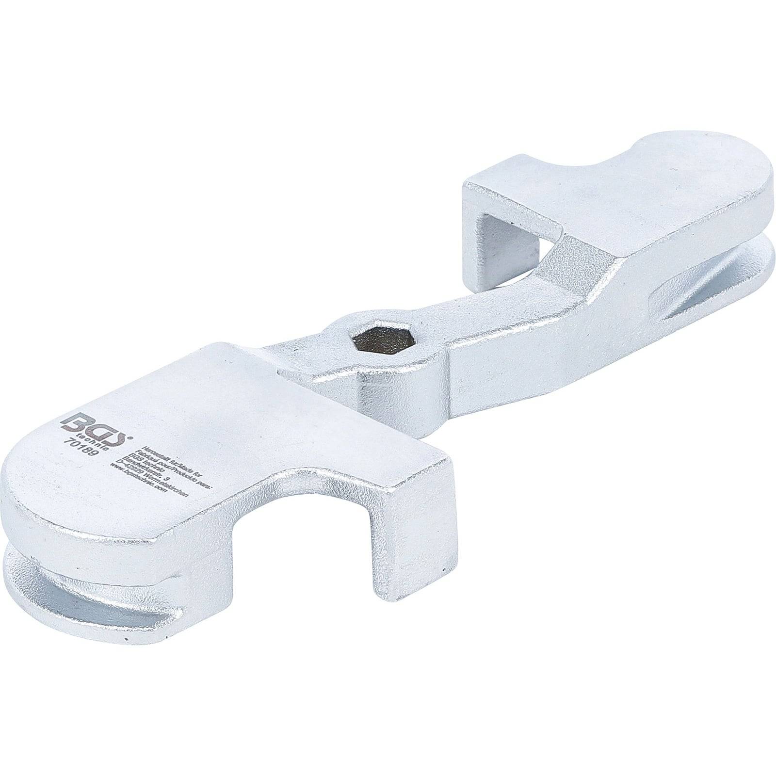 Eine metallische Befestigungsklemme mit einem sechseckigen Zentralloch, entwickelt zum Sichern und Stabilisieren von Komponenten, abgebildet vor einem weißen Hintergrund.