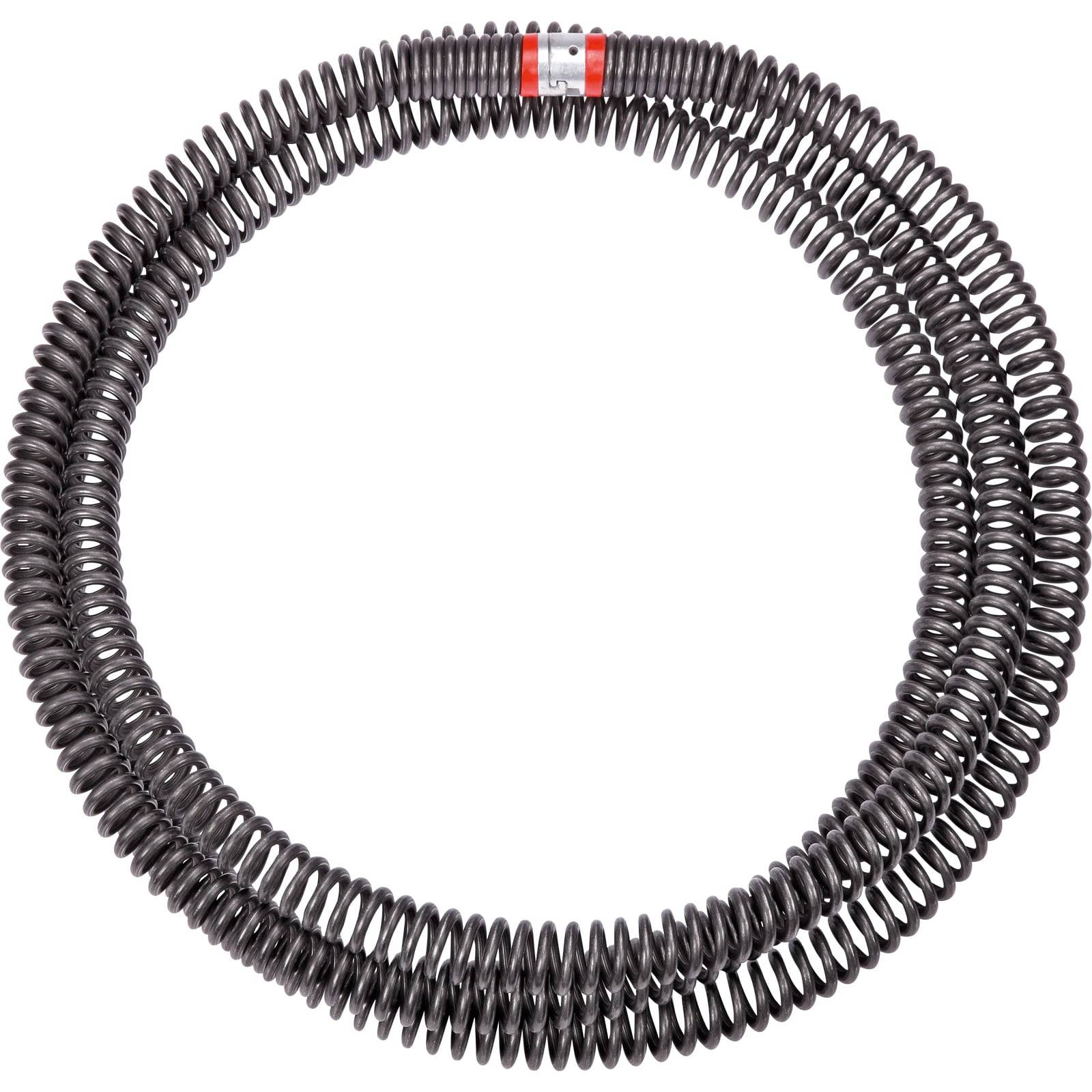 Eine kreisförmige Metallspule mit eng gewickelten Windungen, gleichmäßig um ihren Umfang verteilt, gekennzeichnet mit einem kleinen rot-weißen Etikett.