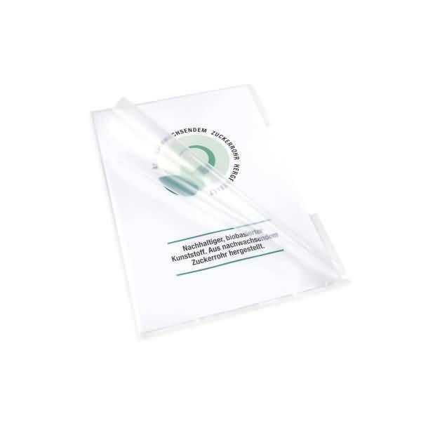 Transparente Verpackung oder Mappe mit grünem Kreislogo und deutschem Text über „nachwachsende Zuckerrohr-Hülle