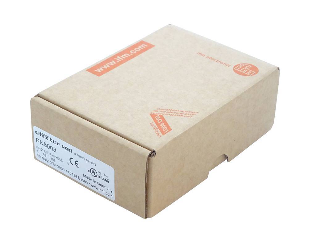 Geschlossene braune Versandkartonage mit einem weißen Produktetikett und orangefarbenem Aufdruck „www.xim.com“.