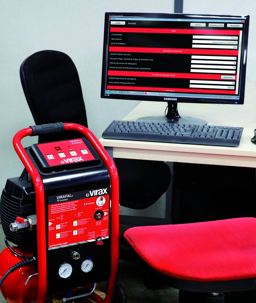 Ein Computer auf einem Schreibtisch zeigt einen Bildschirm mit Text, neben einem roten medizinischen Gerät, das mit „VIRAFAL