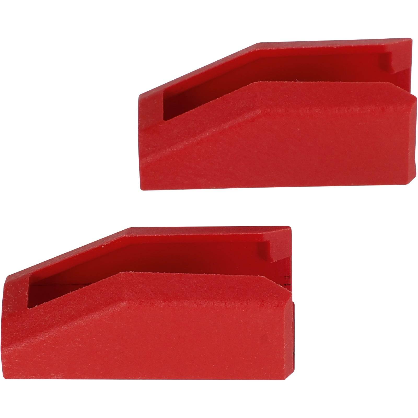 Zwei rote, keilförmige Plastikstücke, die Türkeilen ähneln, parallel zueinander positioniert.
