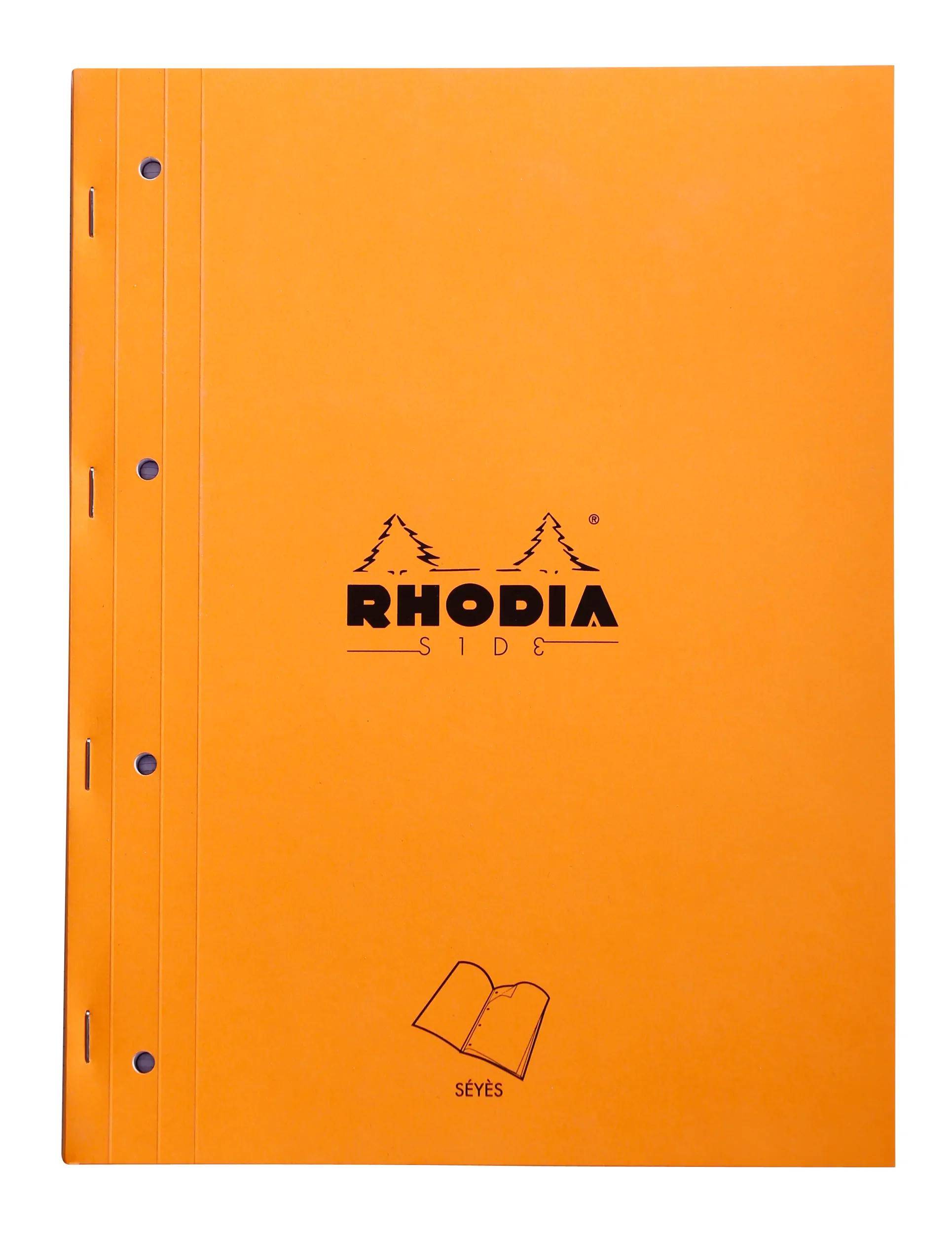 Orange RHODIA SIDE Notizbucheinband mit Bindungslöchern auf der linken Seite und einem kleinen SEYES-Buchsymbol in der Nähe des unteren Randes.