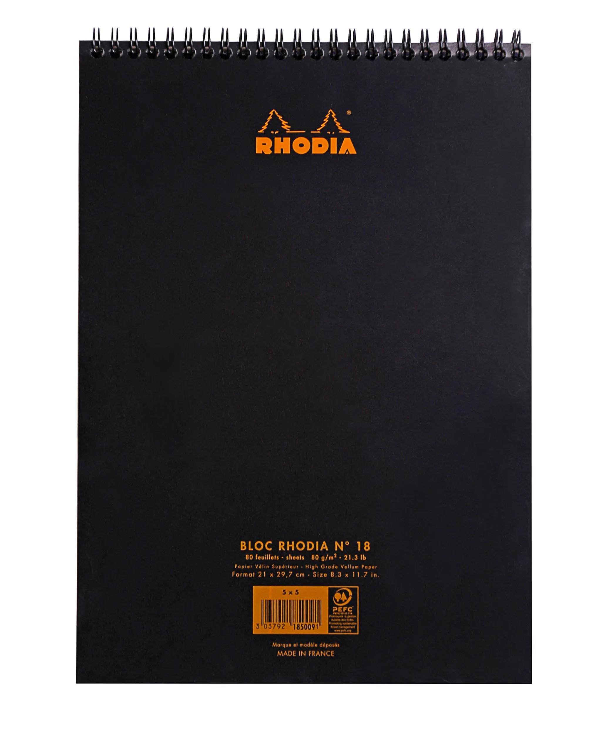 Schwarzes spiralgebundenes Rhodia-Notizbuch mit orangegelbem Logo und Produktetikett auf dem Umschlag.