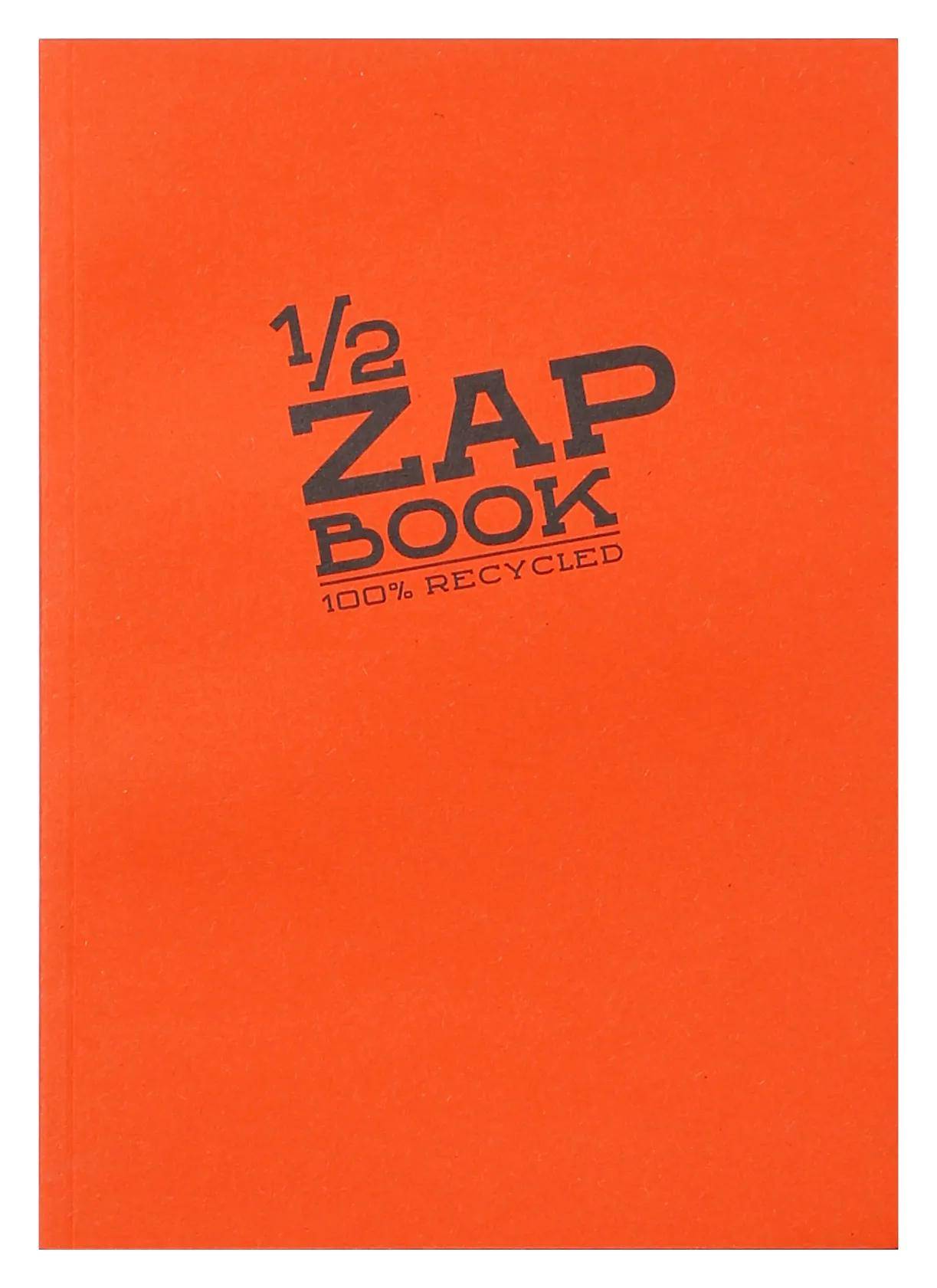 Orange-farbener '1/2 ZAP BOOK' Notizbuch-Umschlag mit der Aufschrift '100% RECYCLED'.