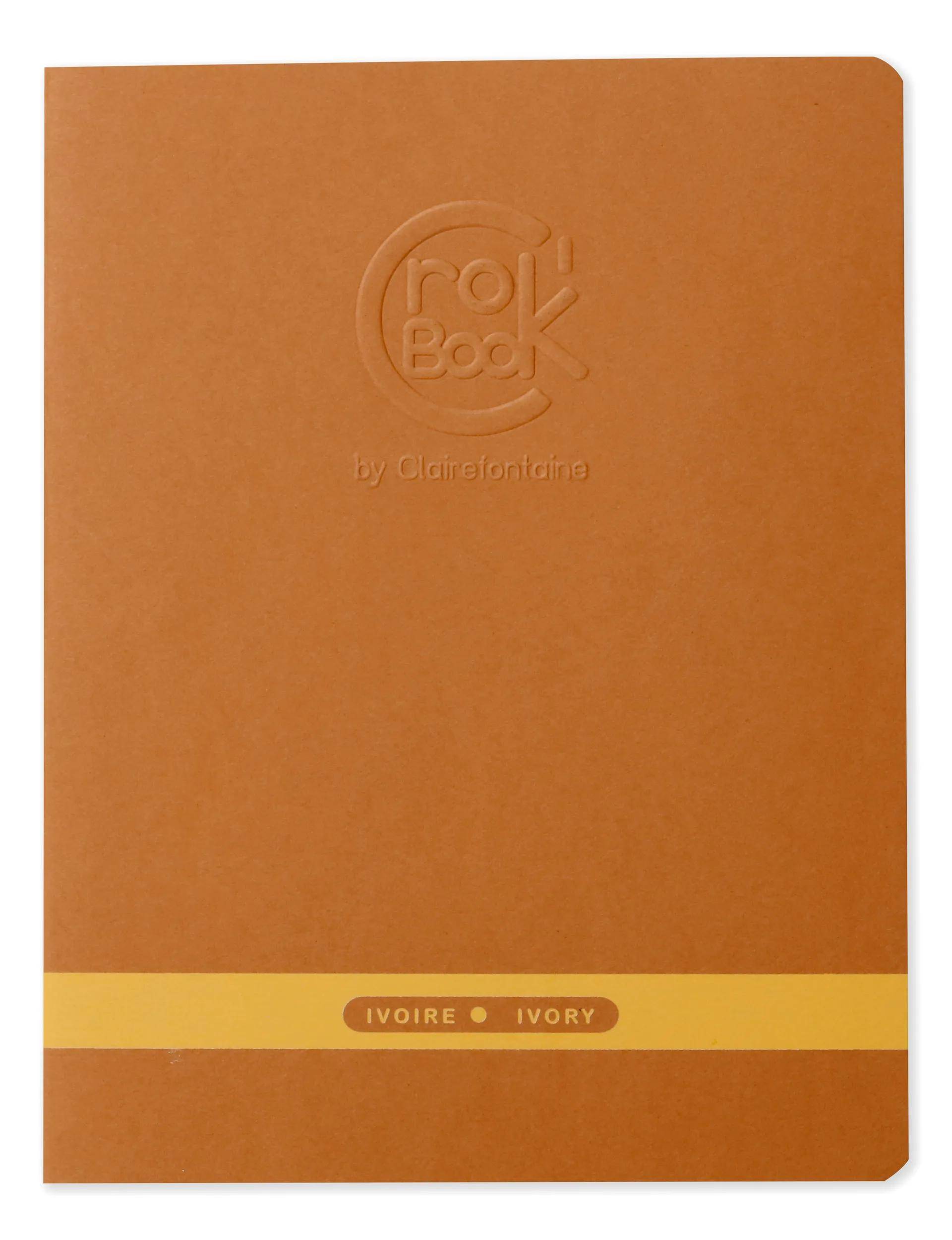 Orange RollBook Notizbuch-Umschlag mit geprägtem Logo und einem gelben Band mit der Aufschrift „IVOIRE • IVORY