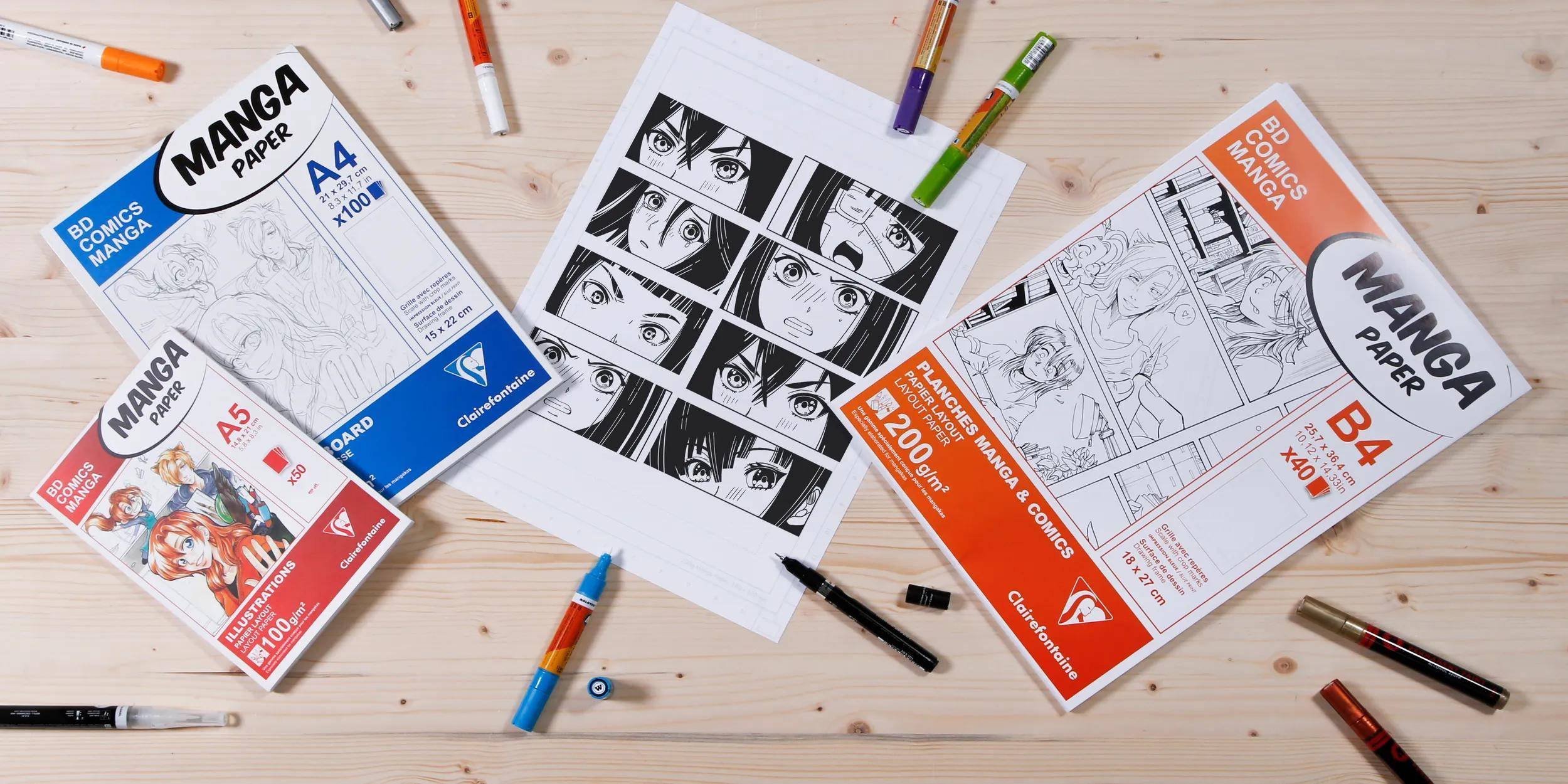 Manga-Zeichenmaterialien auf einem Schreibtisch angeordnet, einschließlich „Manga Paper