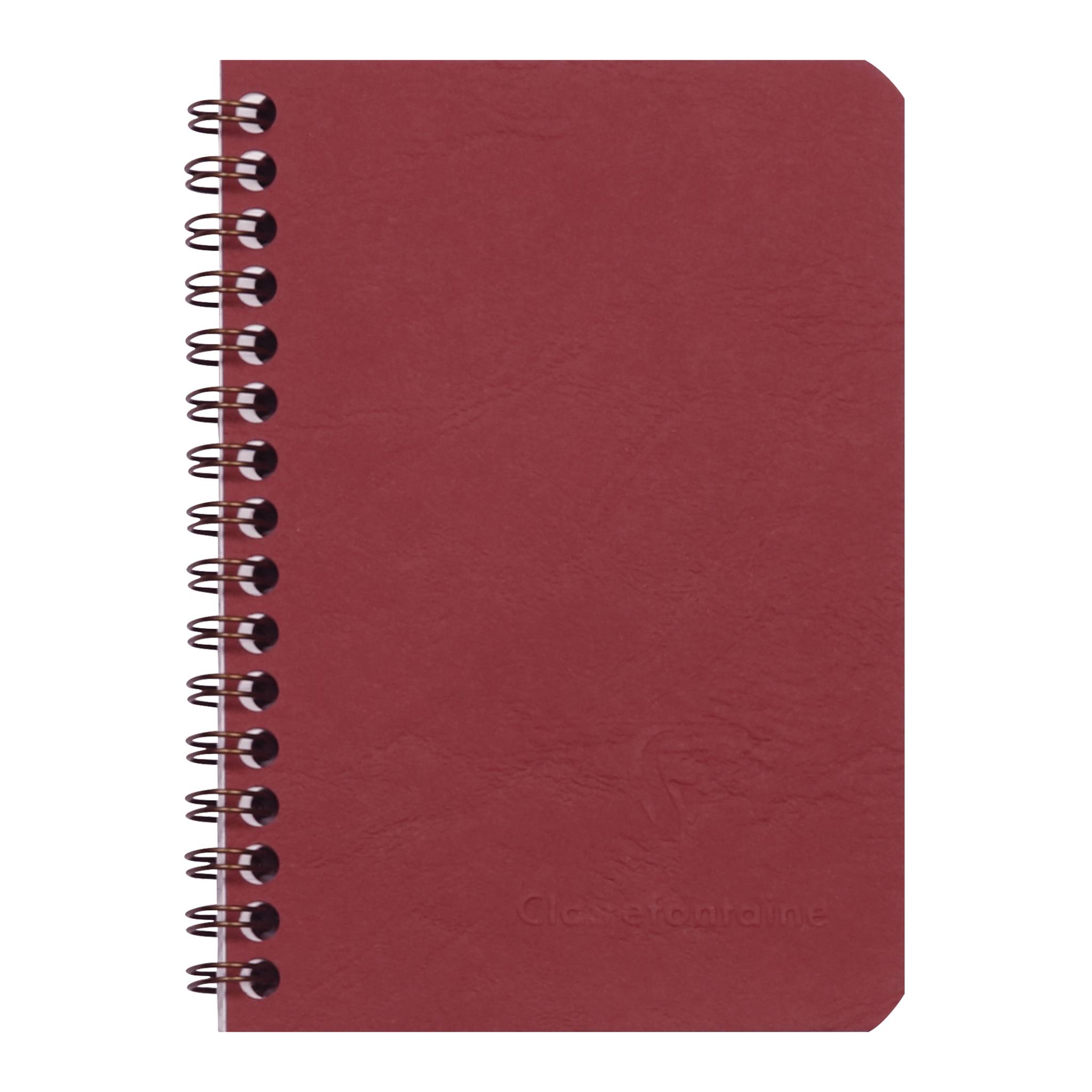 Rotes Spiralbindungs-Notizbuch mit einfachem Umschlag und abgerundeten Ecken, geschlossen vor weißem Hintergrund gezeigt.