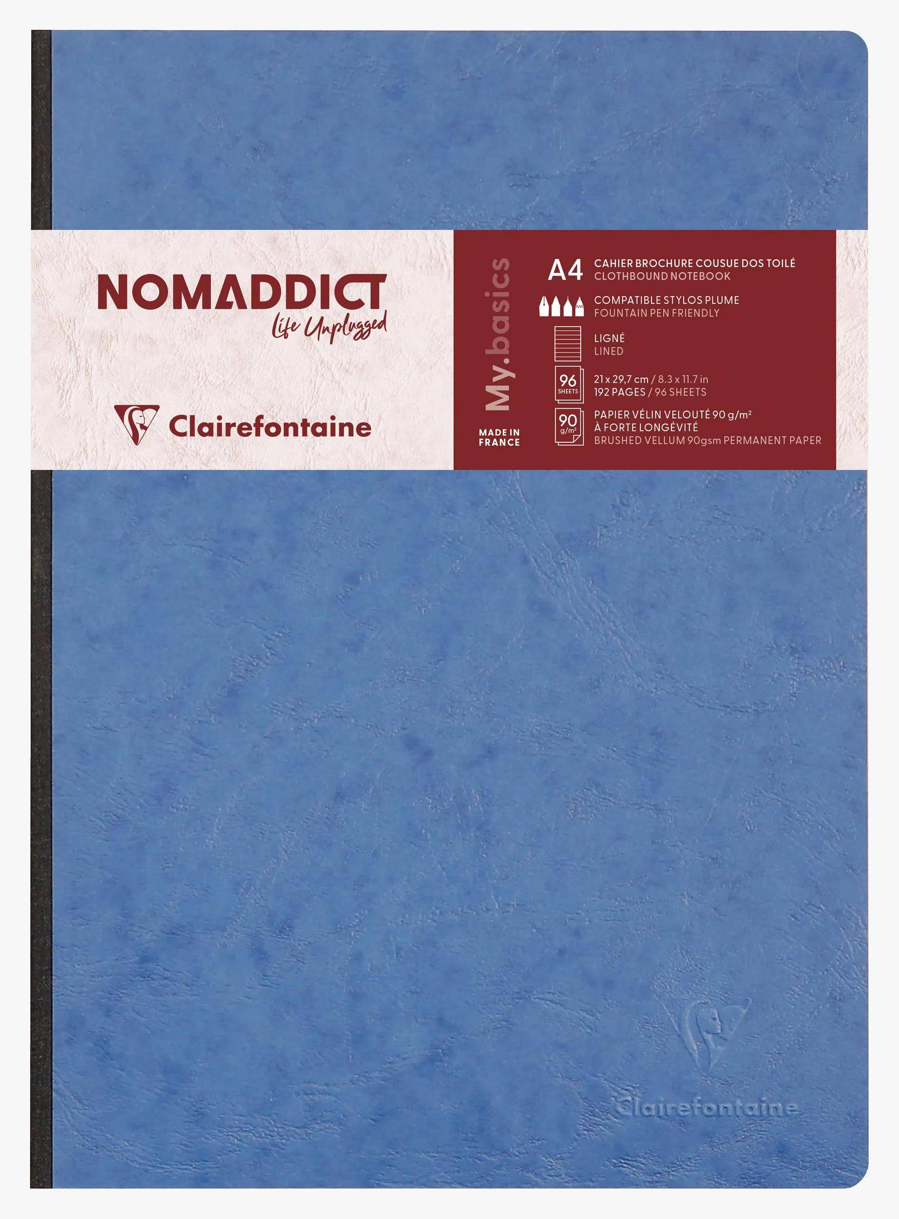 Blaues Clairefontaine 'Nomadict' A4-Notizbuch oder Skizzenblock mit strukturierter Oberfläche und Etikettenband über der Mitte.