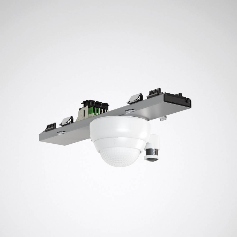 Ein weißer deckenmontierter Sensor mit mehreren schwarzen Anschlüssen oben, verwendet zur Überwachung oder Detektion in kommerziellen oder industriellen Umgebungen.