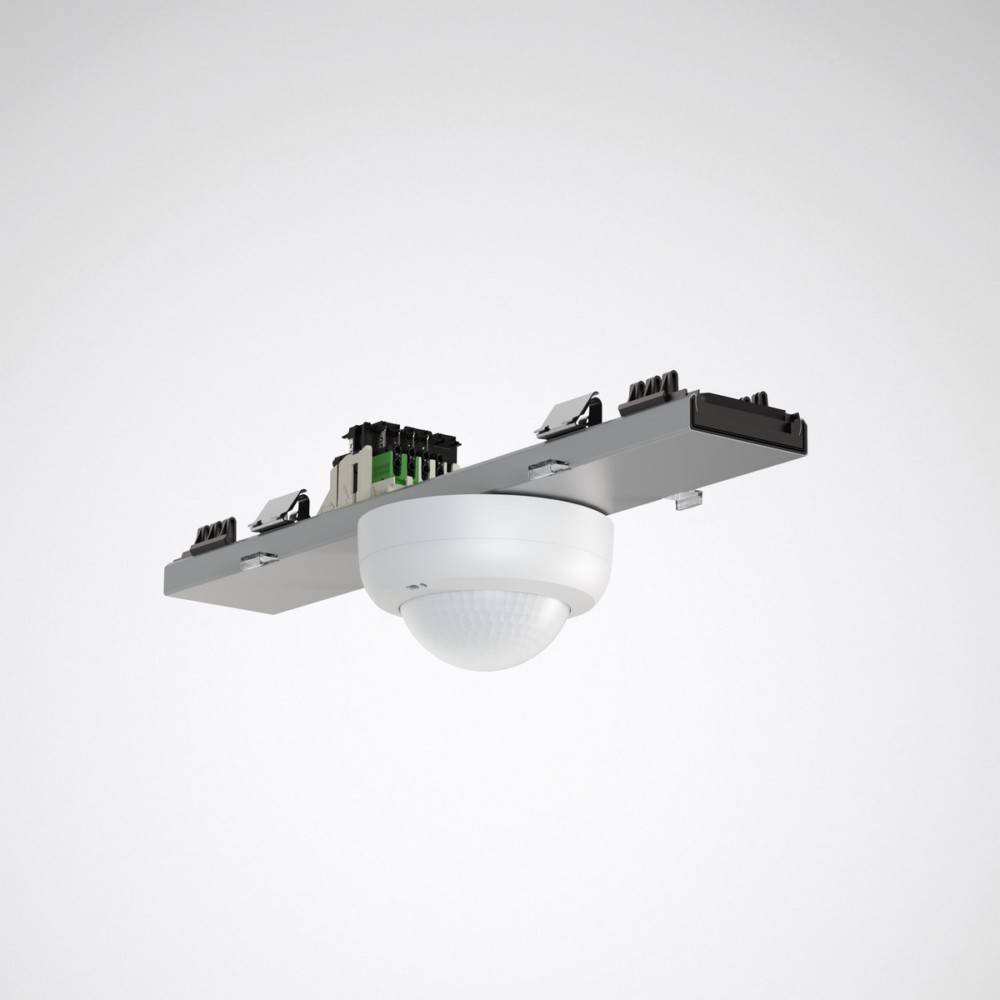 Deckenmontagefähiger Bewegungssensor mit elektronischen Bauteilen an der Oberseite, der zur Bewegungserkennung und Steuerung von Beleuchtungs- oder Sicherheitssystemen verwendet wird.