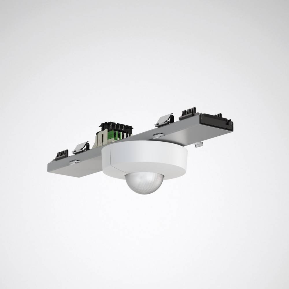 Ein an der Decke montierter Bewegungssensor mit einer weißen kreisförmigen Kuppel und sichtbaren elektronischen Komponenten oben, entwickelt zur Bewegungserkennung in Räumen.