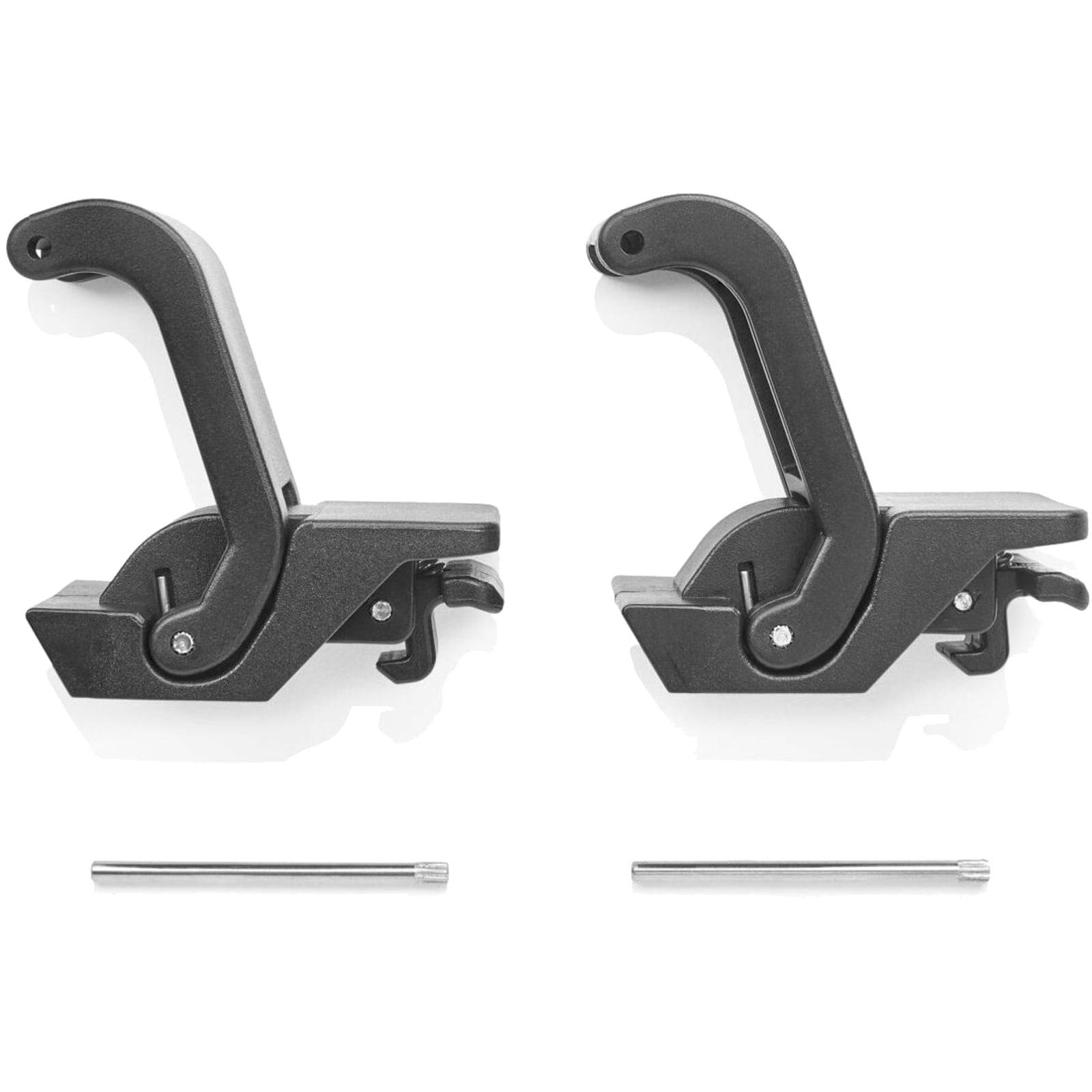 Zwei schwarze mechanische Haken, die einander gegenüber stehen, mit einer Metallstange darunter, die wahrscheinlich zum Befestigen oder Halten von Gegenständen dient.