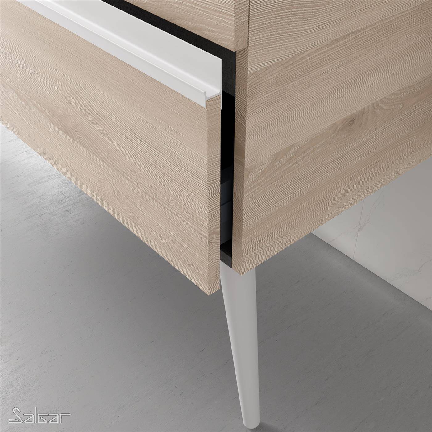 Nahaufnahme einer Ecke eines hellen Holzschranks oder Schreibtischs mit einer teilweise offenen Schublade und einem weißen konischen Bein auf einem grauen Boden.