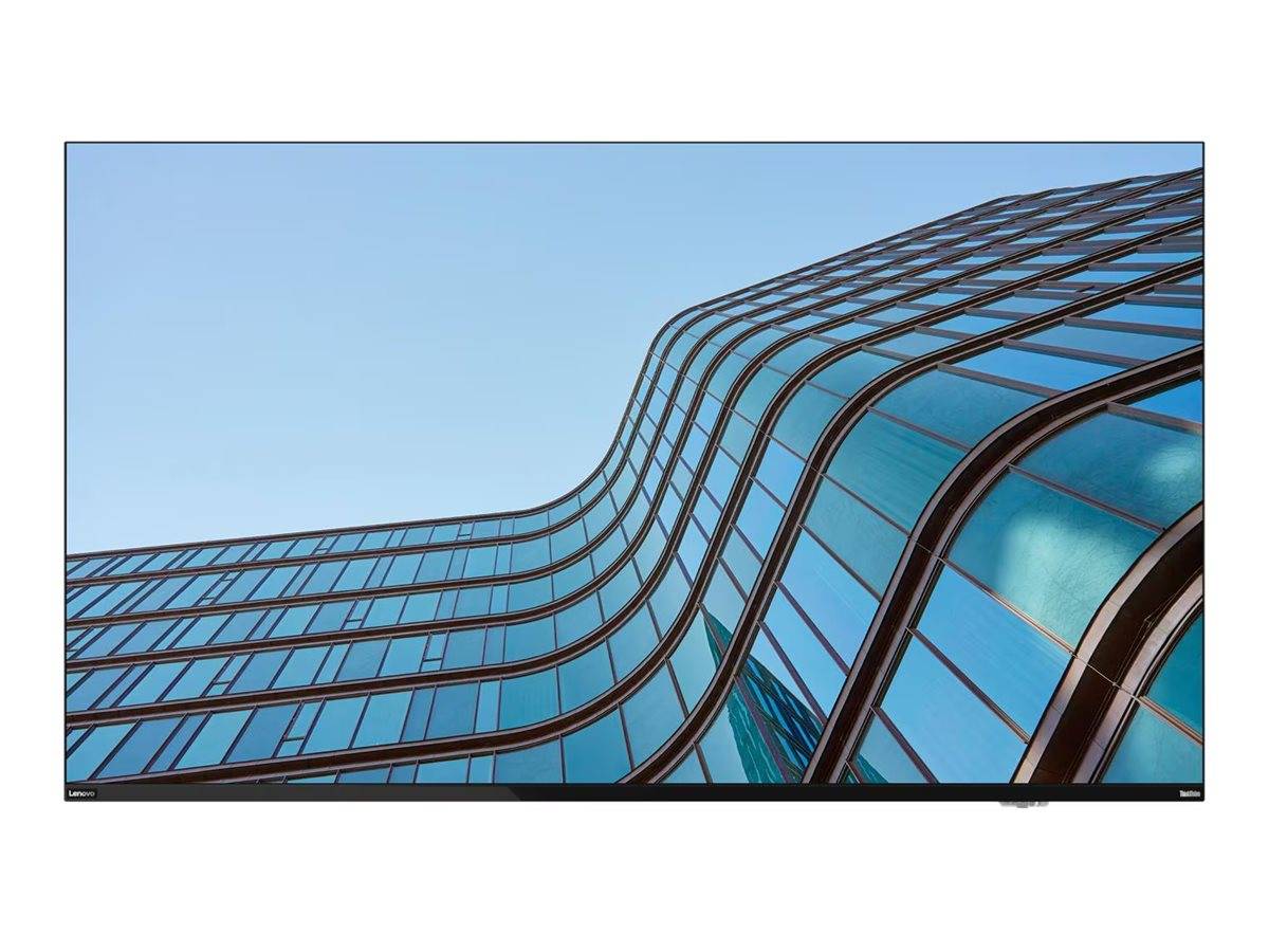 Gekrümmte Glasfassade eines modernen Gebäudes vor einem klaren blauen Himmel, die architektonisches Design und reflektierende Fenster präsentiert.