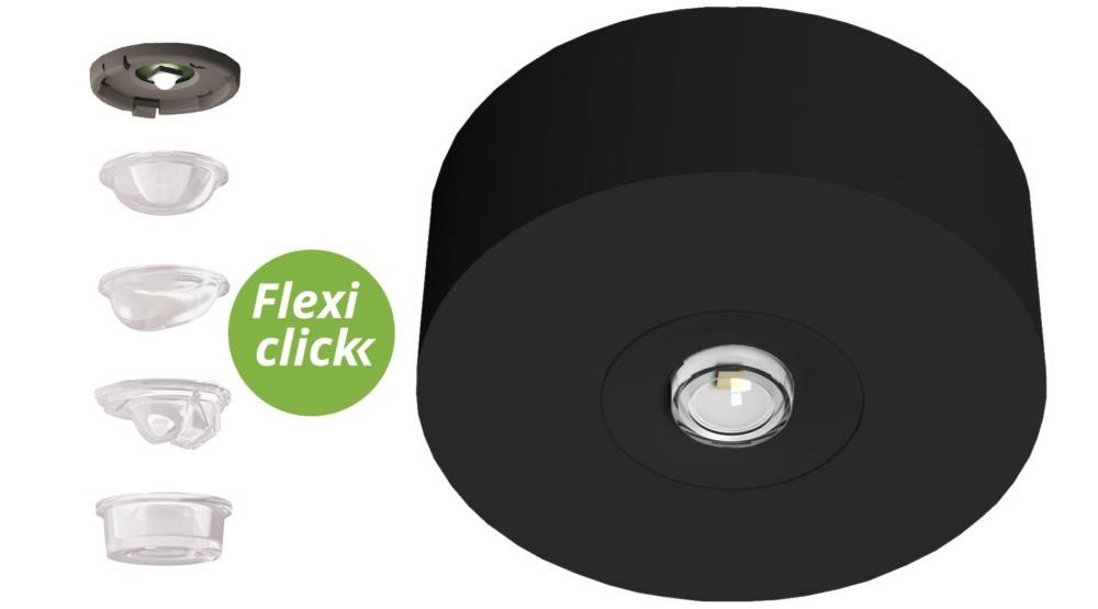 Runde schwarze Deckenleuchte mit einer zentralen LED-Lampe. Ein grünes Etikett an der Seite trägt die Aufschrift ‚Flexi click'.