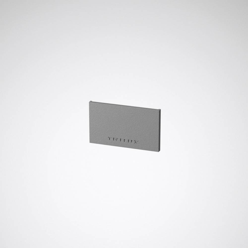 Rechteckige Metallplatte mit der Aufschrift 'TERTIX', zentral vor einem neutralen Hintergrund positioniert.