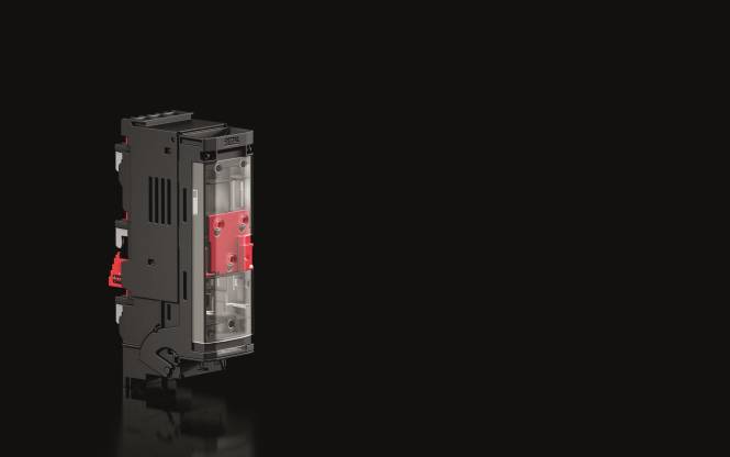 Ein schwarzes elektrisches Gerät mit einer roten Komponente an der Seite, das vor einem dunklen Hintergrund zu sehen ist.