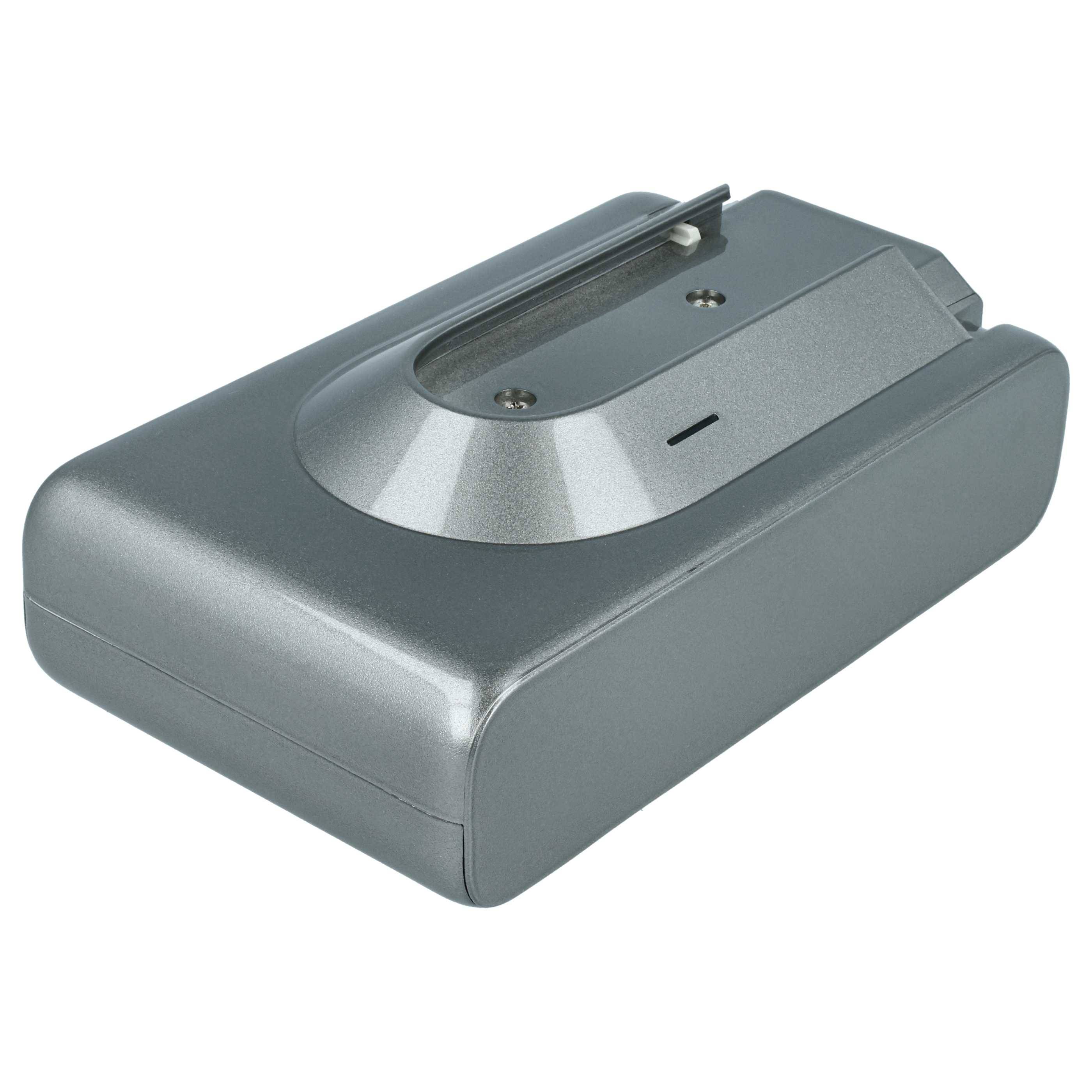 Ein rechteckiges Metallbatterieladegerät mit einem Schlitz an der Oberseite zum Einsetzen von Batterien, designed in einem eleganten, metallischen Finish.