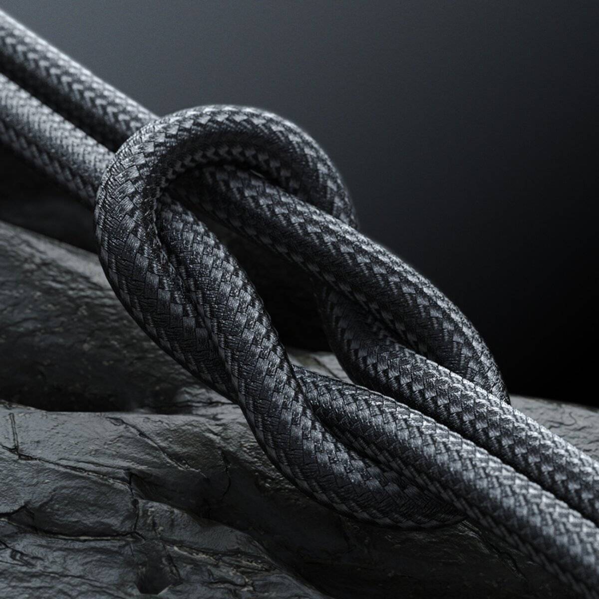 Nahaufnahme von zwei grauen Seilen, die in einem sicheren Knoten auf einer dunklen, texturierten Oberfläche befestigt sind und Stärke und Verbundenheit symbolisieren.