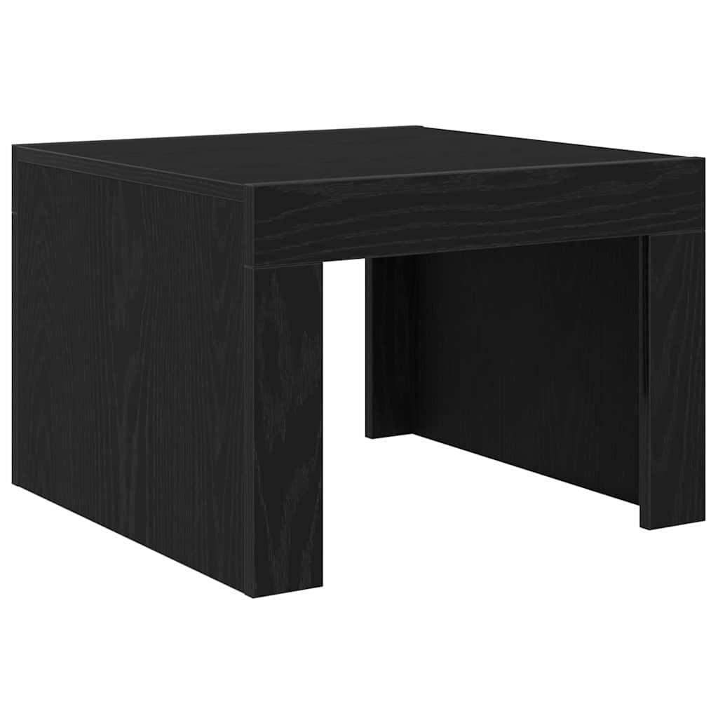 Ein schwarzer, quadratischer Holz-Beistelltisch mit minimalistischem Design und robusten Beinen.