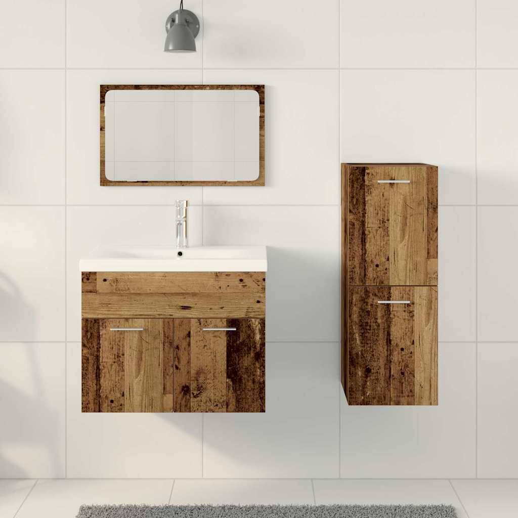 Ein modernes Badezimmer mit einem Waschtisch und Schrank aus Holz, weißem Waschbecken, einem Wandspiegel und einer grauen Deckenlampe an weißen Fliesen.