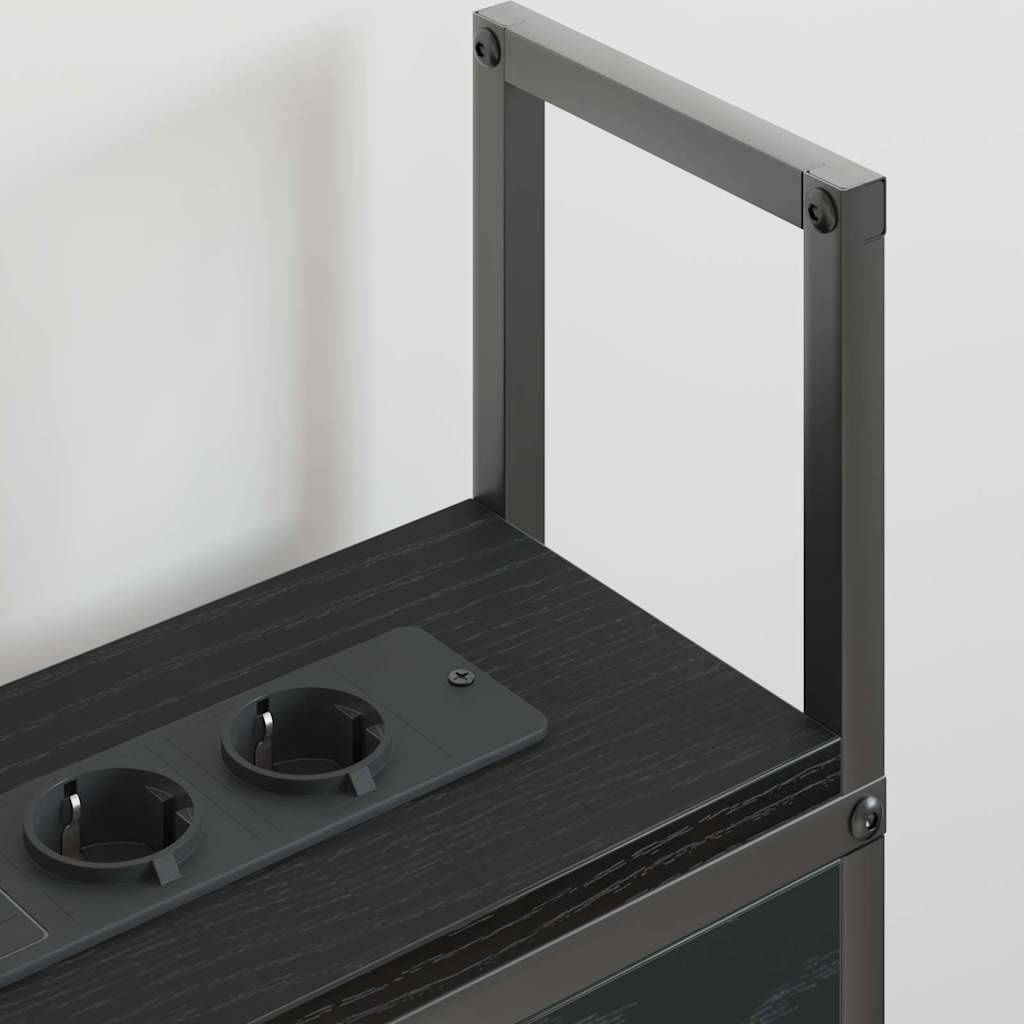 Ein schwarzer Metalltrolley mit zwei freigelegten Elektrosteckdosen auf der Oberseite, vor einem einfachen weißen Hintergrund.