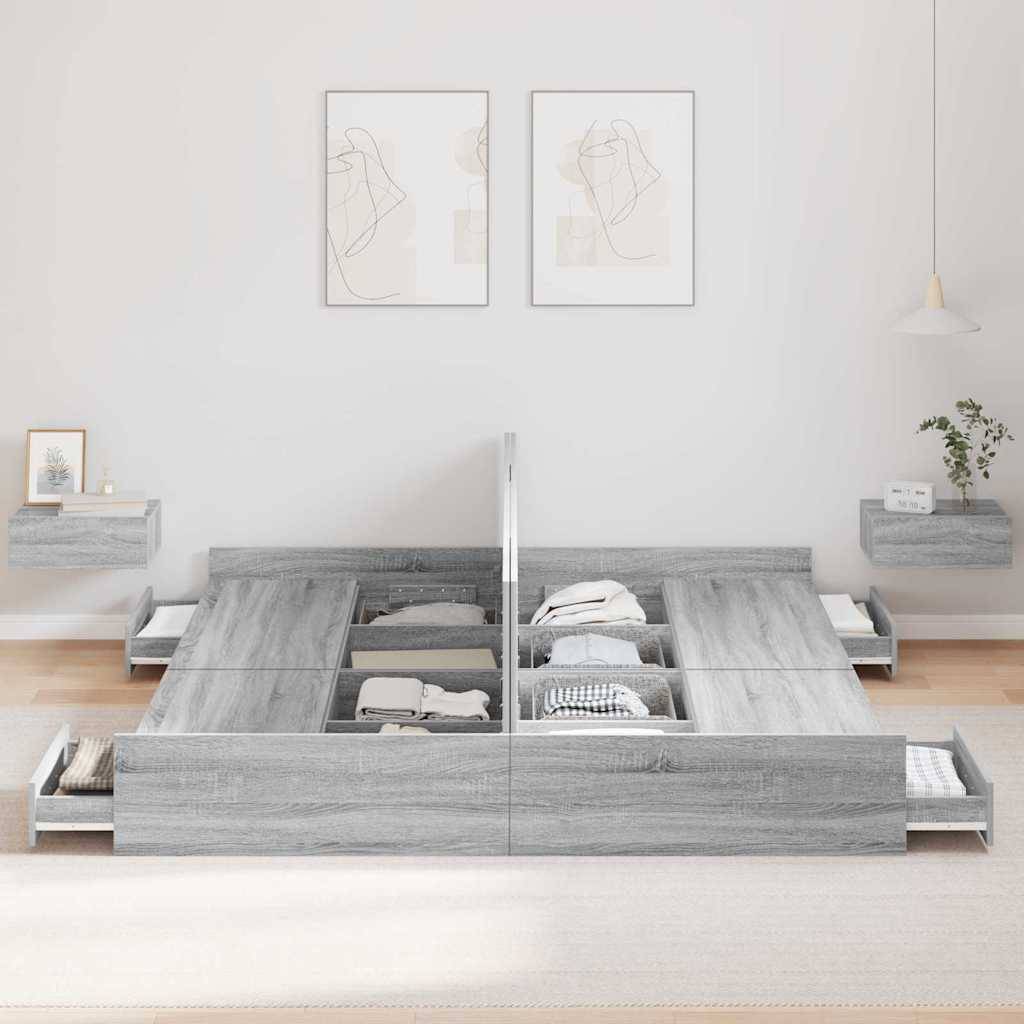 Ein modernes graues Bett mit mehreren offenen Schubladen, ordentlich sortiert mit gefalteten Kleidungsstücken. Minimalistische Dekoration umfasst zwei wandmontierte Nachttische.