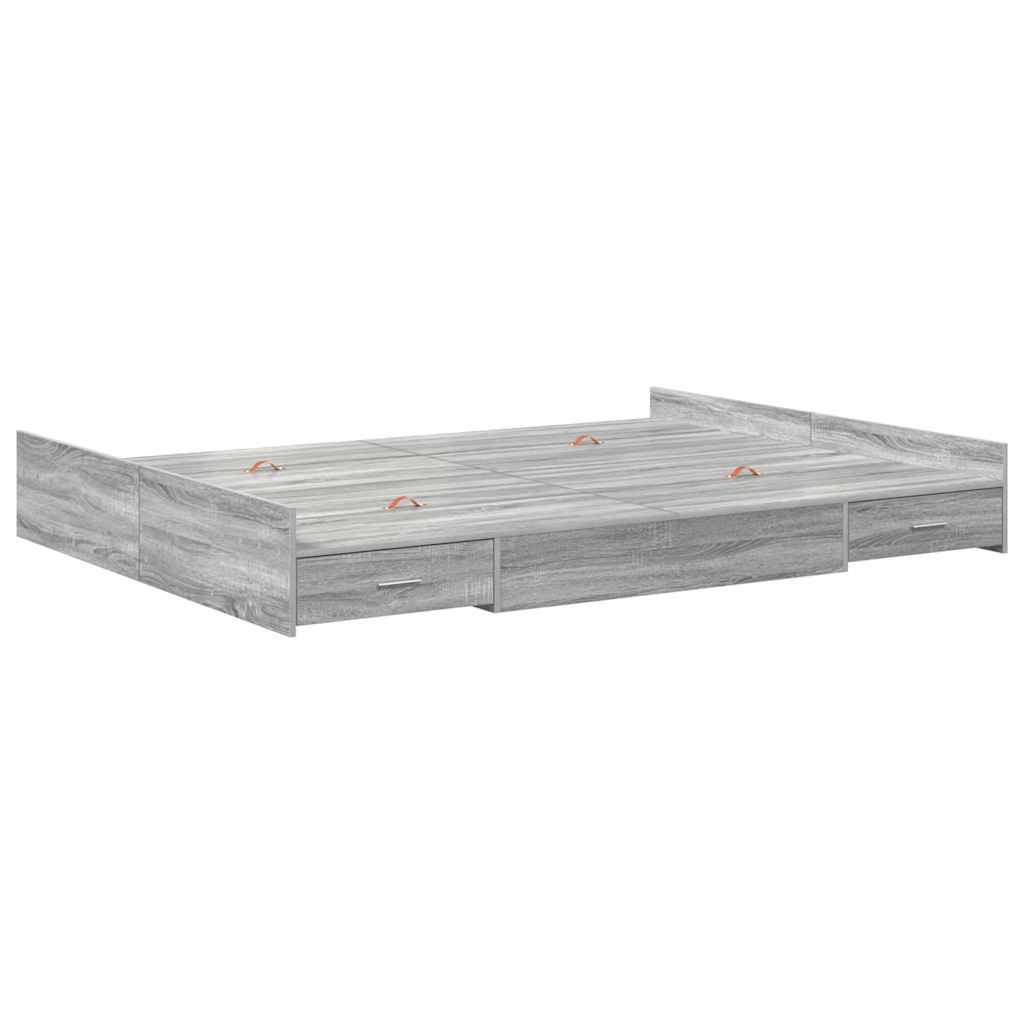 Ein grauer Holz-Stauraumbett mit mehreren Schubladen darunter für zusätzlichen Stauraum, entworfen, um eine Standardmatratze ohne Kopfteil aufzunehmen.