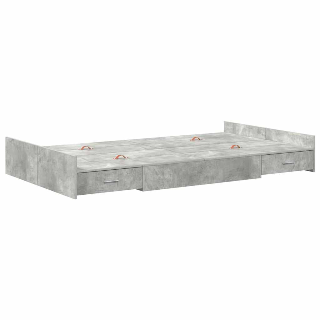 Ein grauer Bettrahmen mit Betonstruktur, ausgestattet mit zwei Aufbewahrungsschubladen darunter und zwei Griffen oben.
