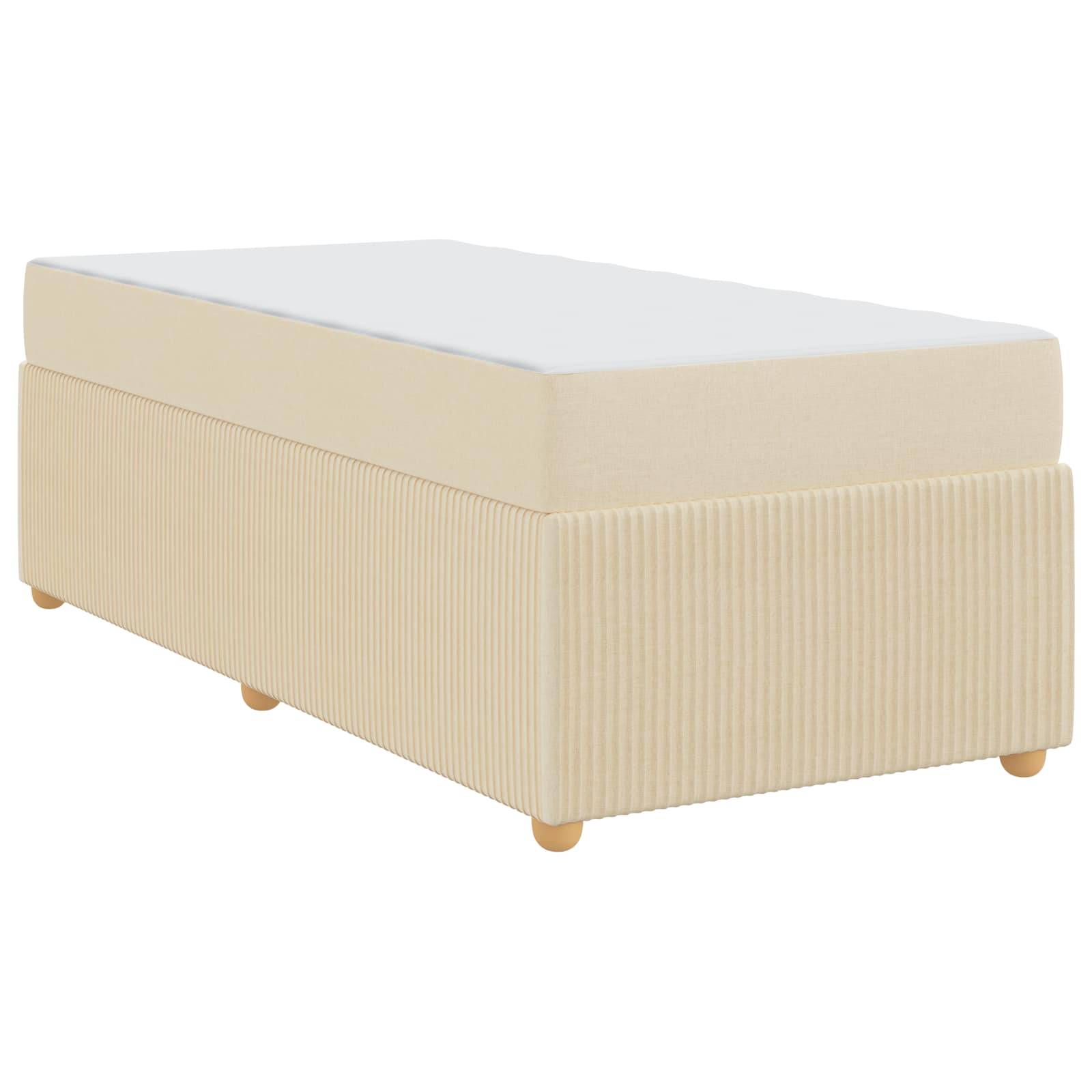 Ein beiger Doppelbett-Boxspringrahmen mit geripptem Stoffdesign und hellen Holzbeinen.