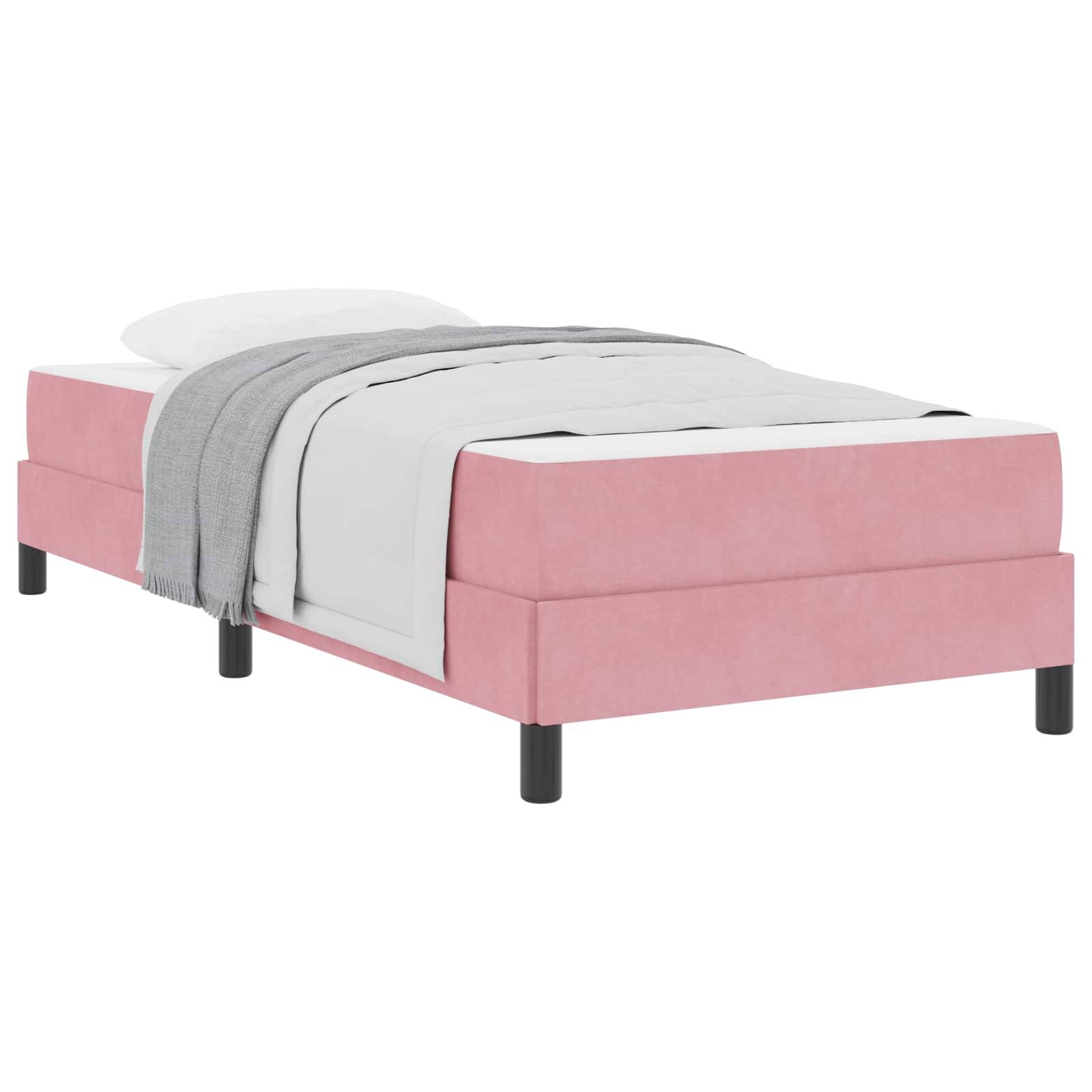 Ein rosa gepolstertes Bett mit einer weißen Matratze, grauer Decke und Kissen. Das Bett hat ein modernes Design mit schwarzen Beinen.
