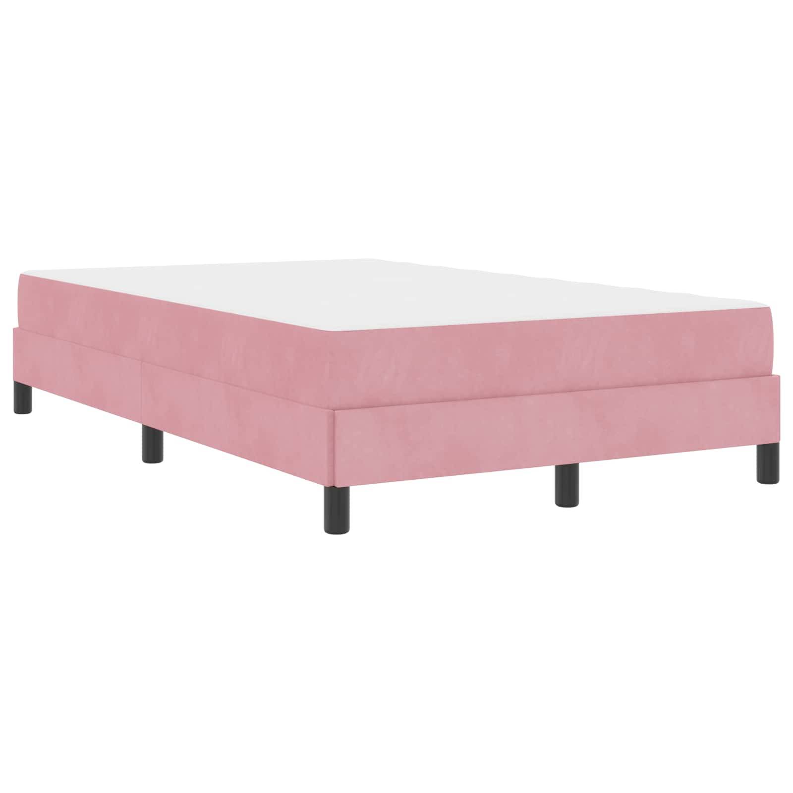Pinkes Polsterbettgestell mit schwarzen Beinen, von einem niedrigen Blickwinkel aufgenommen. Das Bett hat ein schlichtes, minimalistisches Design.