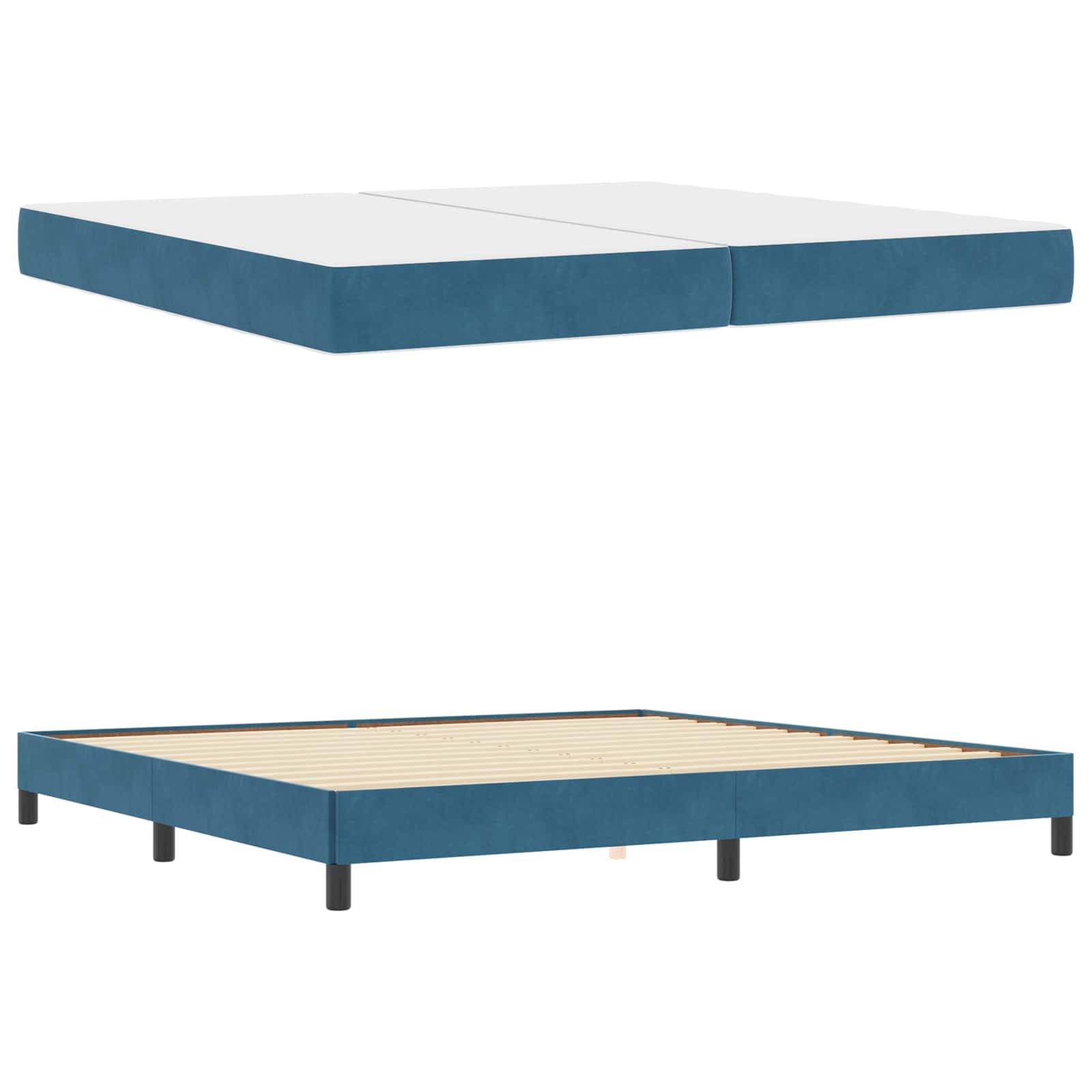Ein minimalistisches, flaches Bettgestell mit gepolsterter blauer Basis und schwarzen Beinen, ausgestattet mit Holzlatten zur Matratzenunterstützung.