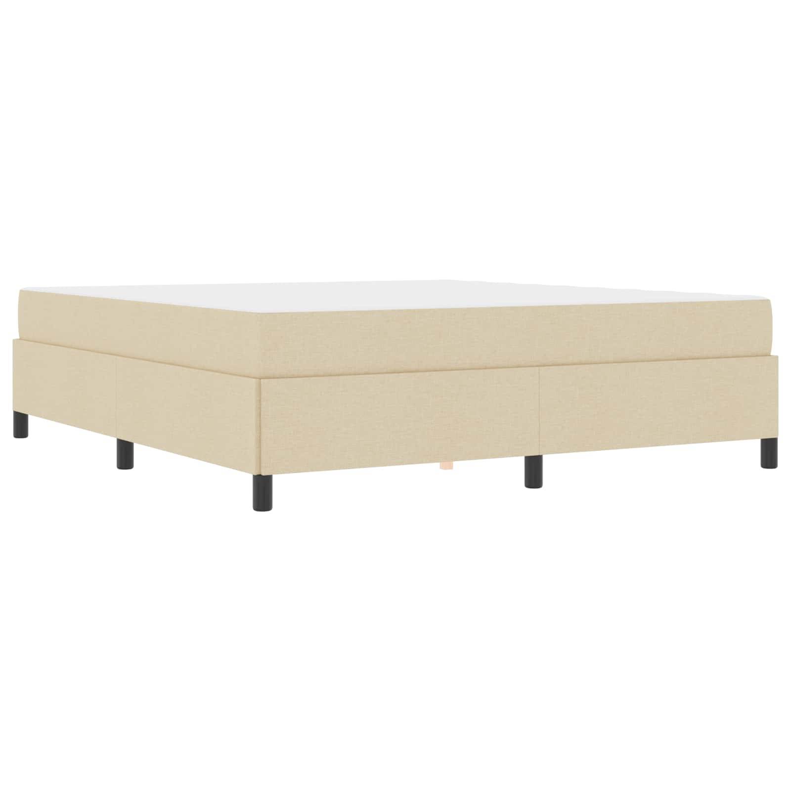 Beigefarbene Plattformbett-Basis mit schwarzen Beinen, von der Seite gesehen.