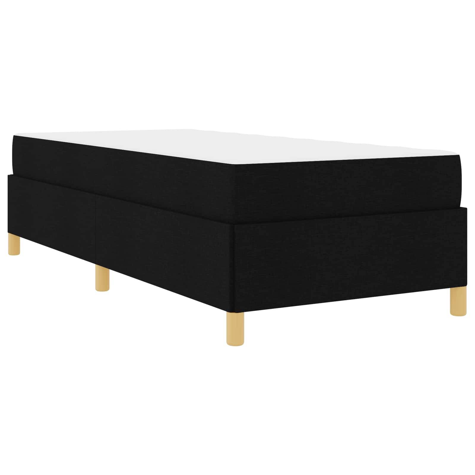 Eine schwarze gepolsterte Boxspringmatratze mit Holzbeinen, konzipiert für ein Einzelbett und eine moderne und minimalistische Basis für Matratzen.