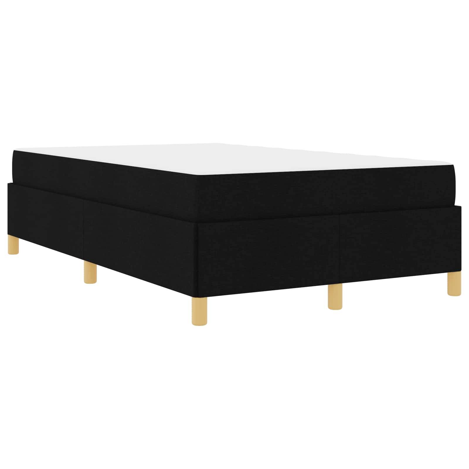 Ein schwarzes, mit Stoff bezogenes Plattformbett mit einer weißen Matratze, getragen von Holzbeinen. Modern und minimalistisches Design.
