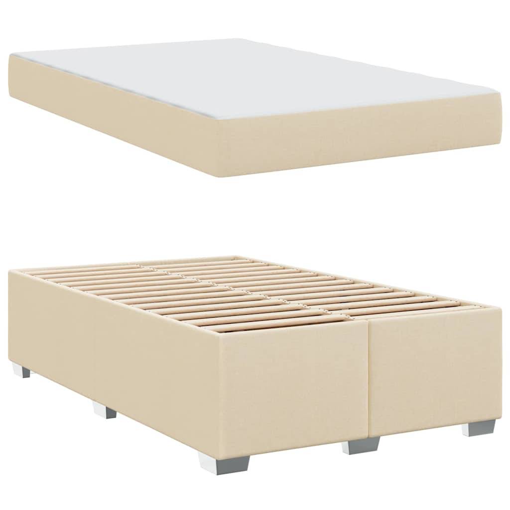 Ein beiger Bettrahmen mit passender Boxspring, der eine Lattenrost-Konstruktion zur Matratzenunterstützung aufweist.