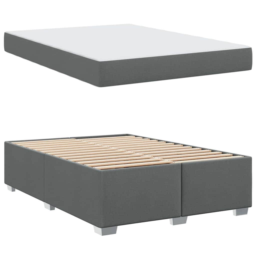 Grauer Boxspring und Unterbau: Boxspring mit Holzlatten auf einer stabilen Basis, entwickelt zur Unterstützung einer Matratze.