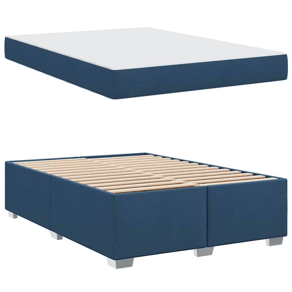 „Bild zeigt einen blauen gepolsterten Bettrahmen mit Holzlatten und einer weißen Matratze. Der Rahmen hat ein schlichtes, modernes Design mit kurzen Beinen.