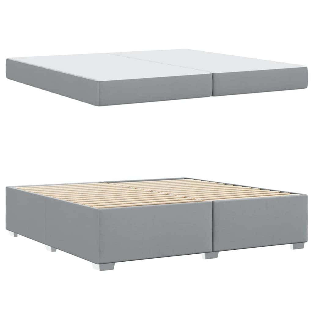 Eine graue gepolsterte Bettbasis mit sichtbaren Holzlatten und schlichtem modernem Design, geeignet zur Unterstützung einer Matratze.