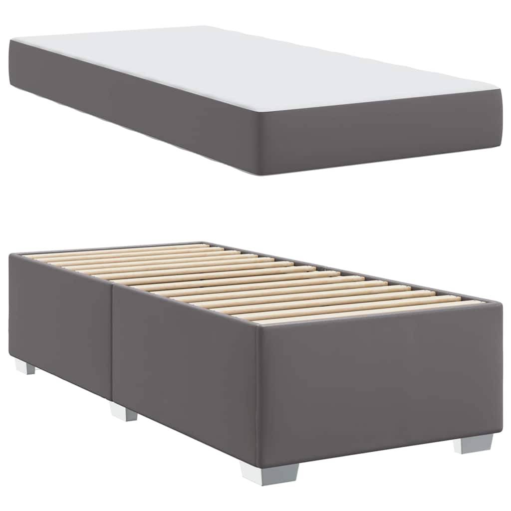 Graues Plattformbett mit Lattenrost und separatem weißem Matratzentopper. Modernes und minimalistisches Design.
