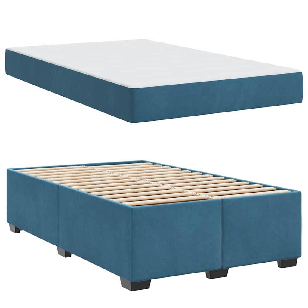 Eine blaue gepolsterte Bettfundamentbasis mit einem sichtbaren Holzlattenrahmen im unteren Bereich; die obere Hälfte zeigt das Bett ohne sichtbare Latten.