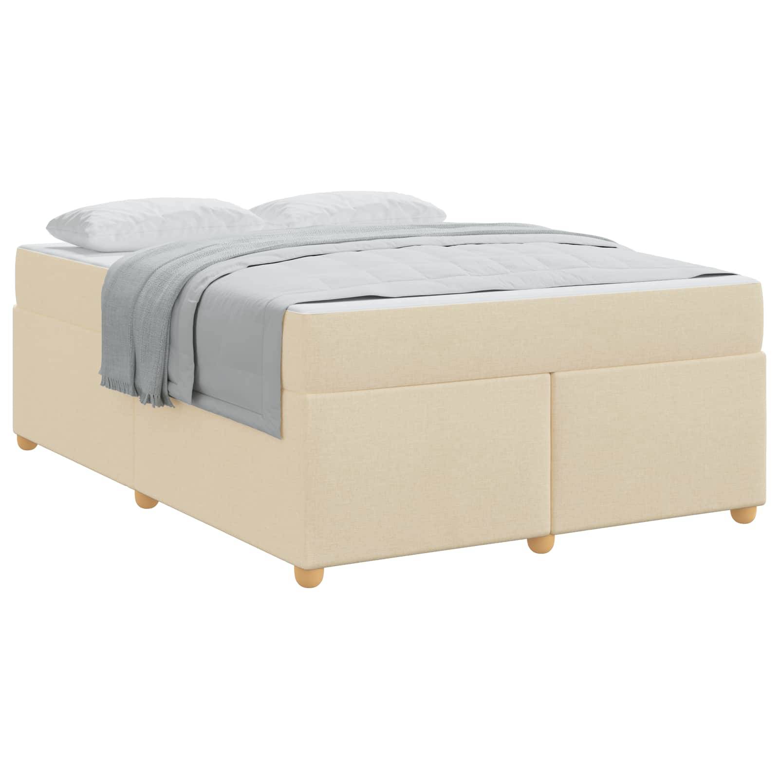 Beige gepolstertes Bett mit weißer Bettwäsche und grauer Decke, vor weißem Hintergrund gezeigt.