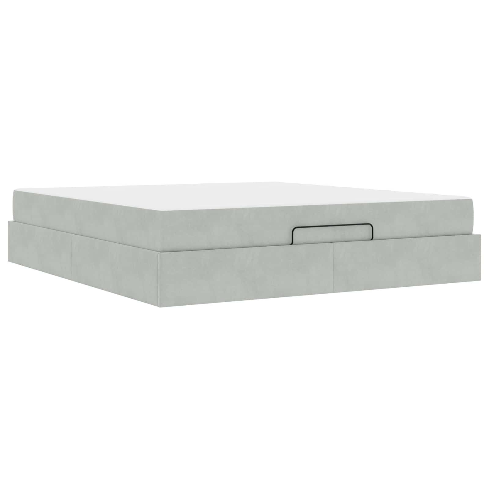 Ein minimalistisches graues Boxspringbett mit einem versteckten Staurauszug, das durch ein schlankes und einfaches Design überzeugt.