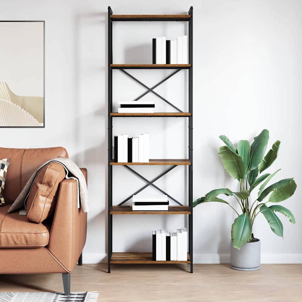 Modernes Wohnzimmer mit einem hohen schwarz-holzernen Bücherregal mit Büchern, neben einem beigefarbenen Sofa und einer Topfpflanze vor einer weißen Wand.