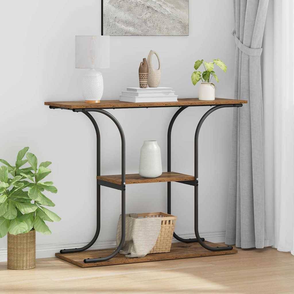 Konsolentisch aus Holz und schwarzem Metall mit oberer und unterer Ablage, gestaltet mit Lampe, Büchern, Vase, Korb und Pflanzen in einem hellen Raum.