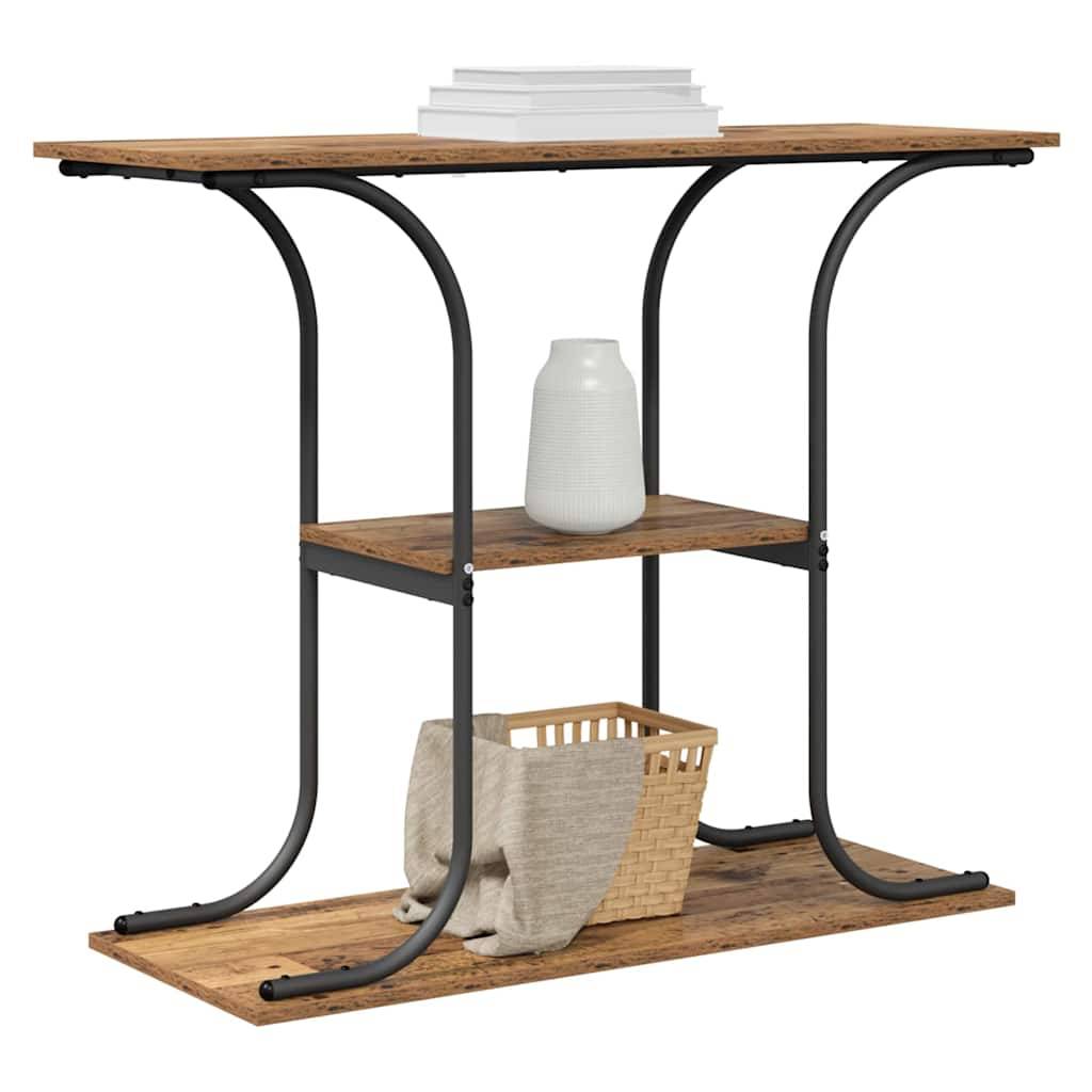 Dreilagiges rustikales Holz- und Schwarzmetall-Regal mit einer Vase auf dem mittleren Regal und einem Korb sowie einem gefalteten Tuch auf dem unteren Regal.
