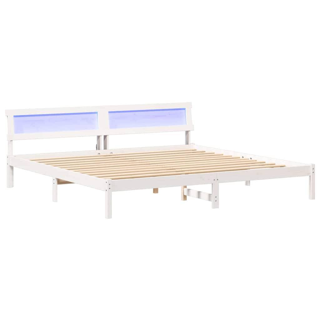 Weißer Holzbettgestell mit Lattenrost und einem Kopfteil, das zwei blau beleuchtete Paneele aufweist. Geeignet für moderne Schlafzimmereinrichtung.