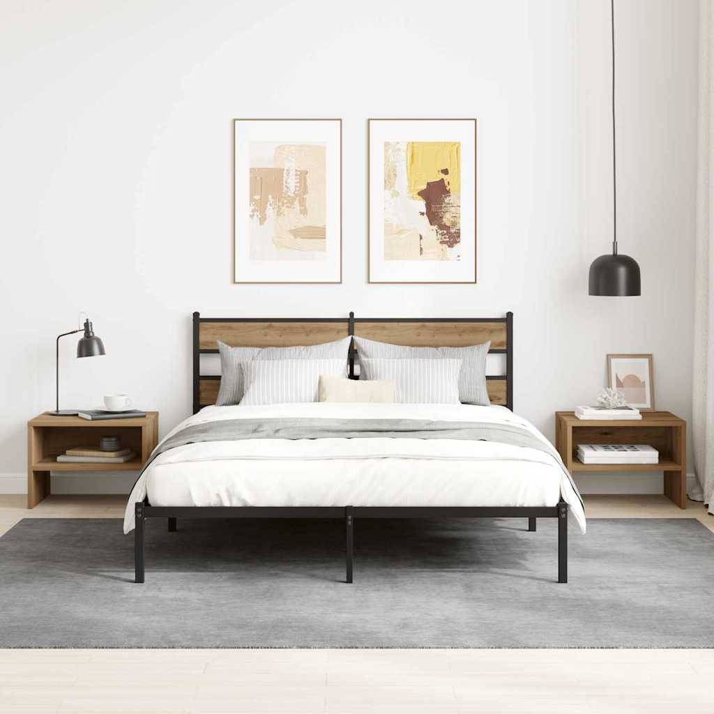 Ein modernes Schlafzimmer zeigt ein ordentlich gemachtes Bett mit grauer Bettwäsche, Holznachttischen und zwei abstrakten Kunstwerken an der Wand darüber.